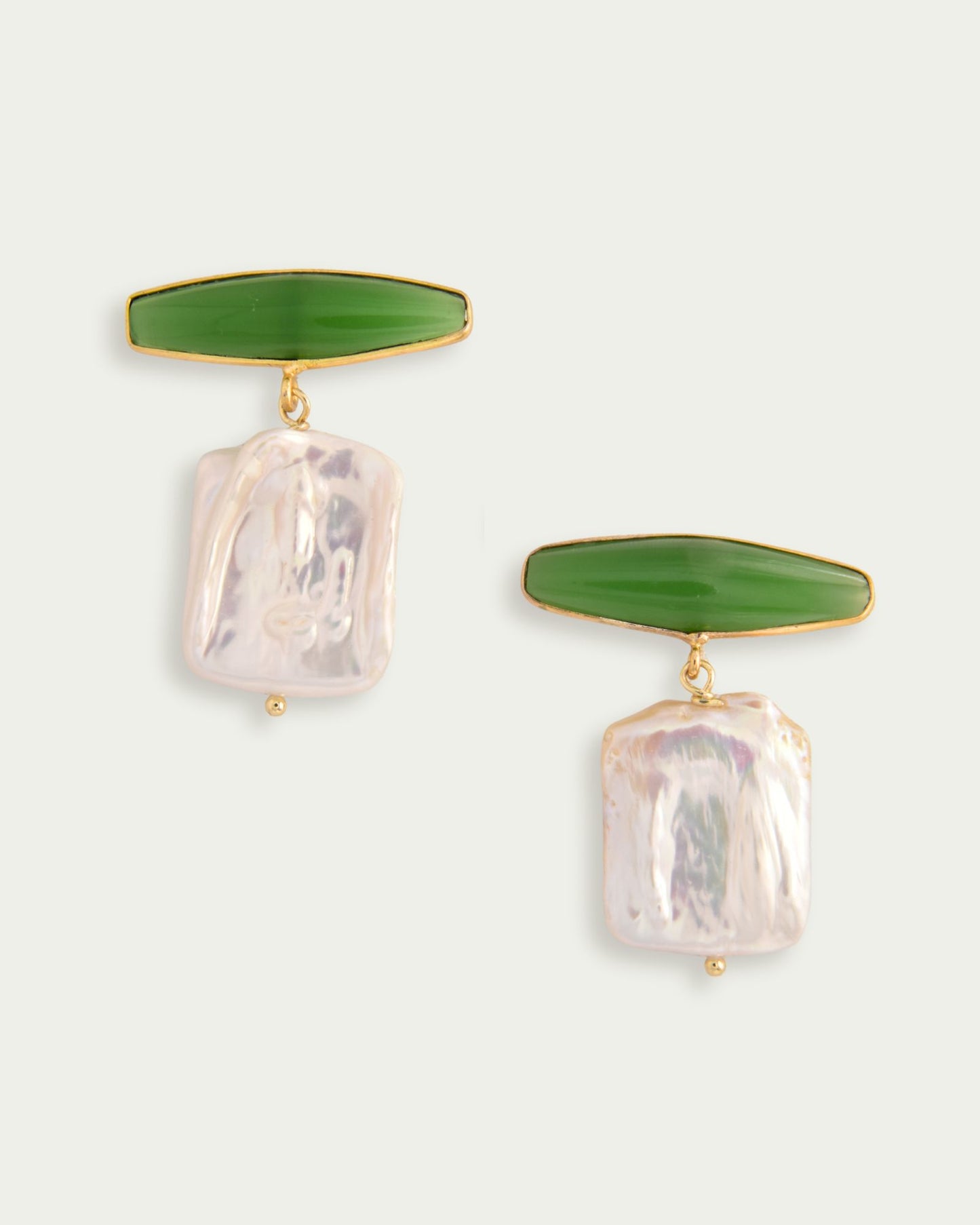 Elegant earrings featuring elongated green stone tops with rectangular iridescent pearl drops, connected by gold loops. A modern, chic design.